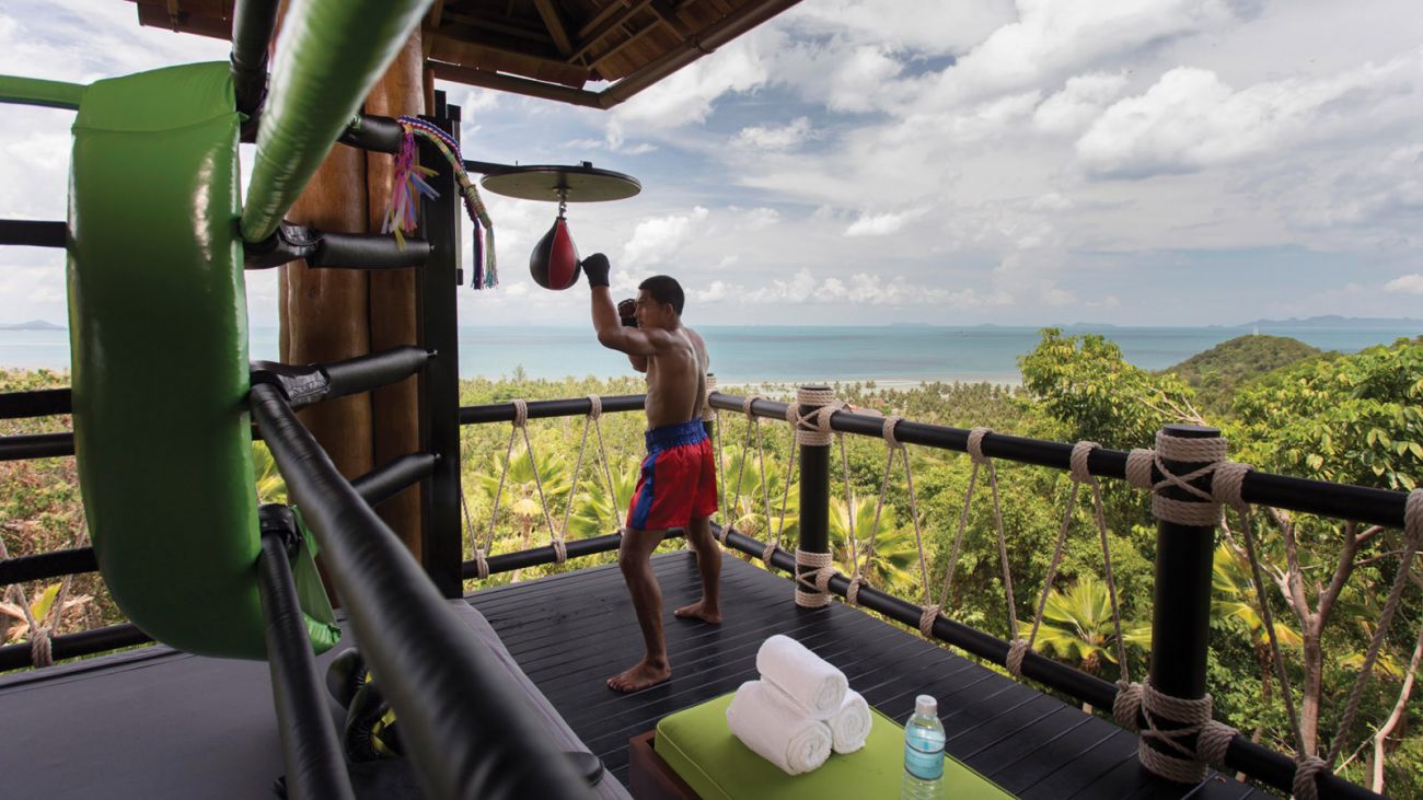 At Four Seasons Resort Koh Samui take part in Muay Thai training at the propertys iconic boxing ring set in the hills with 240-degree views of the ocean and jungle